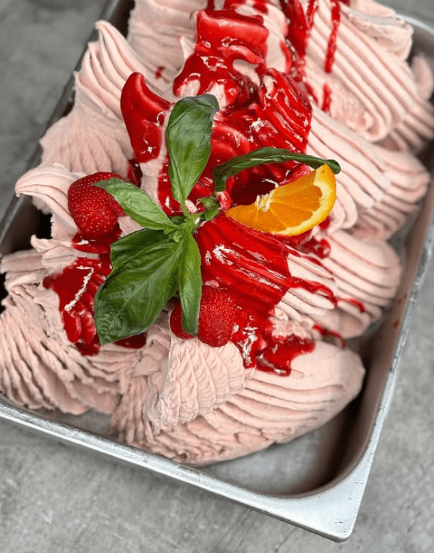 Strawberry icecream with orange and basil