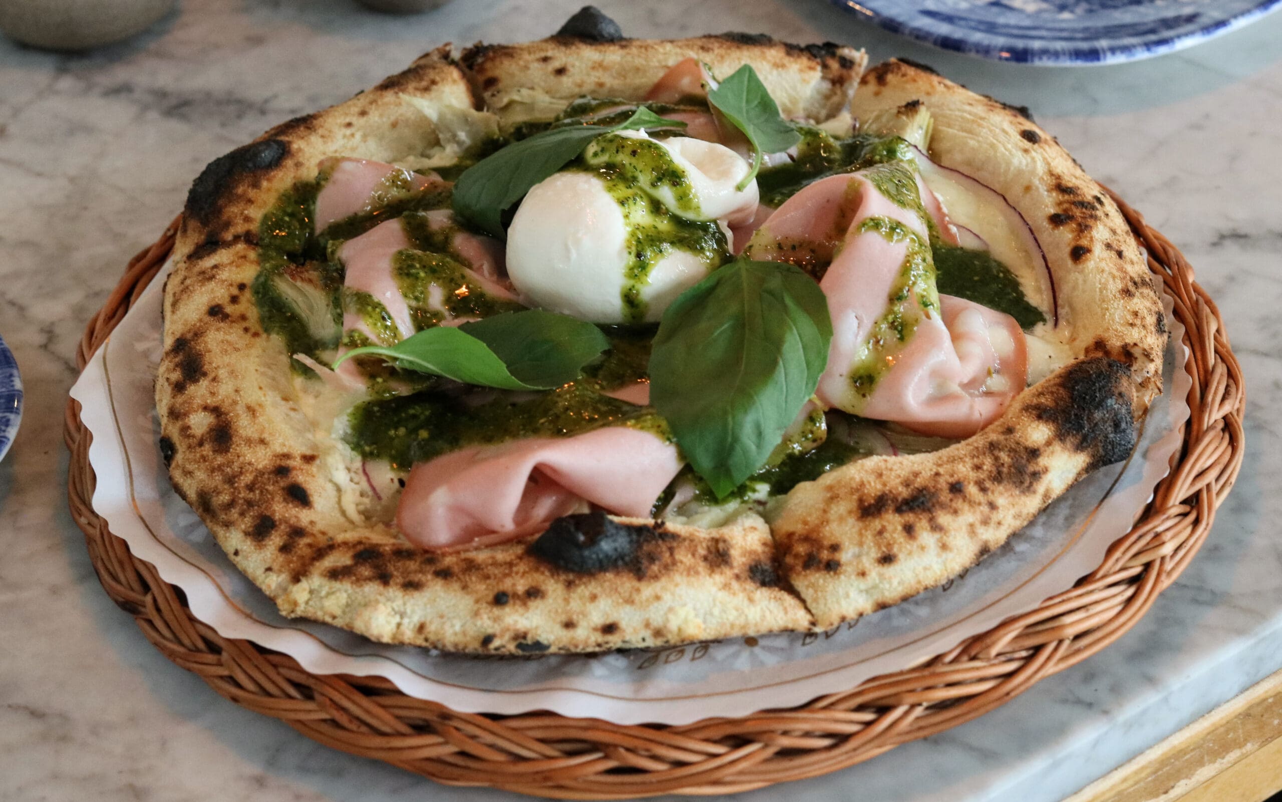 Pizza with burrata and ham