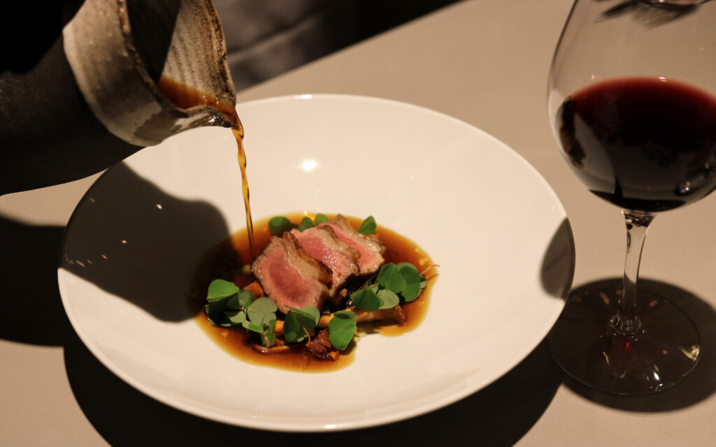 Dish consisting of meat with a glas of red wine